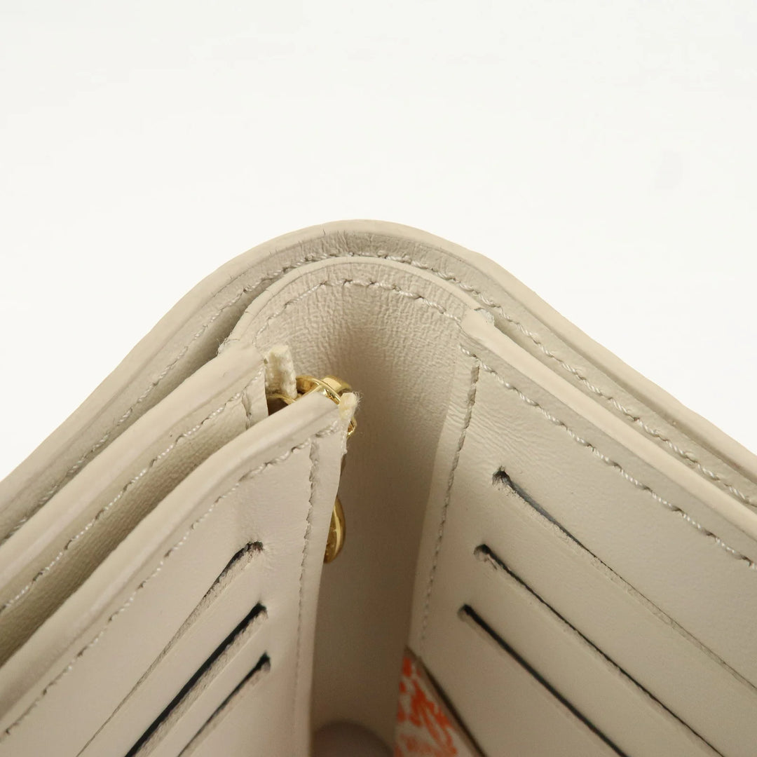 Louis Vuitton Capcines Taurillon Leather Vertical Wallet M11169
