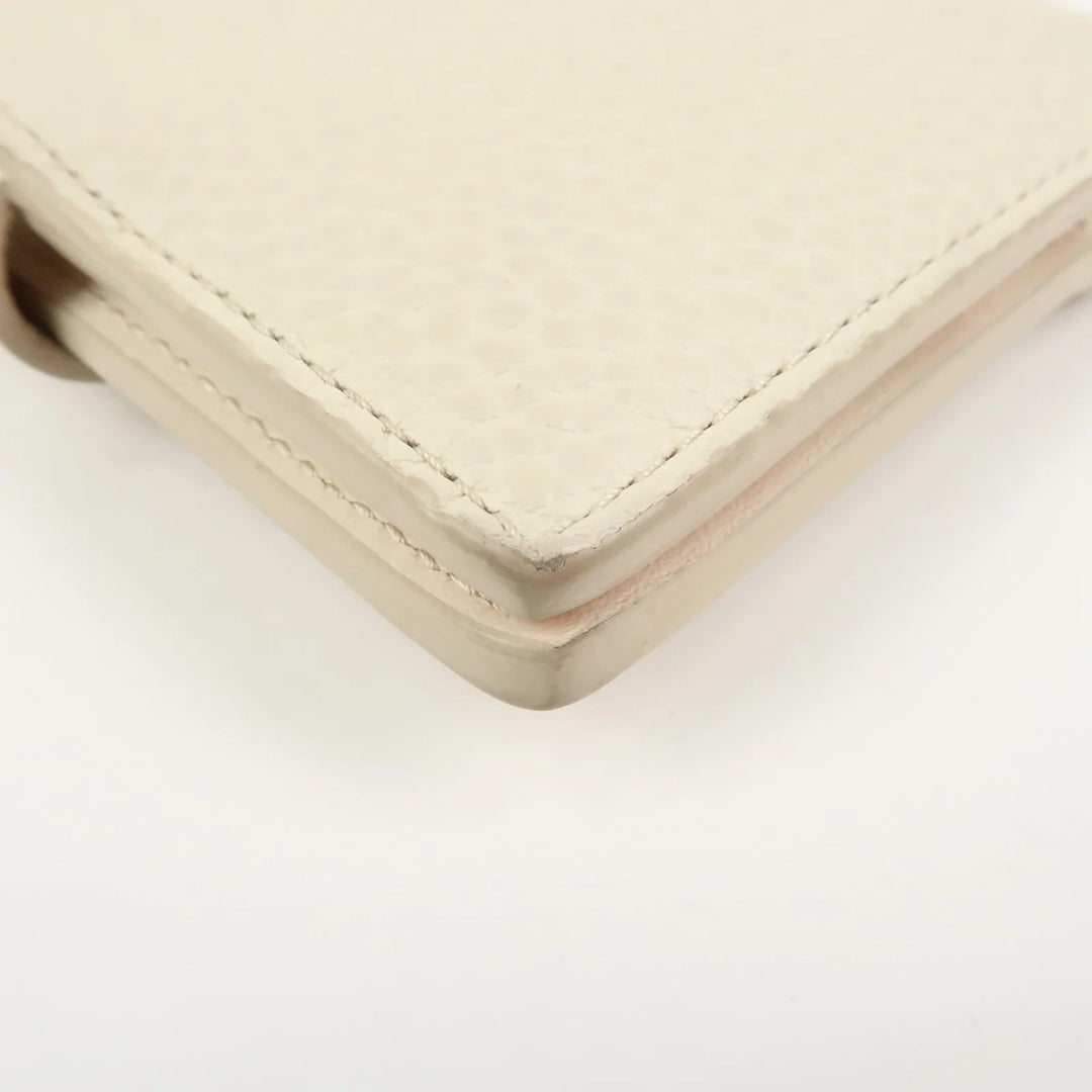 Louis Vuitton Capcines Taurillon Leather Vertical Wallet M11169