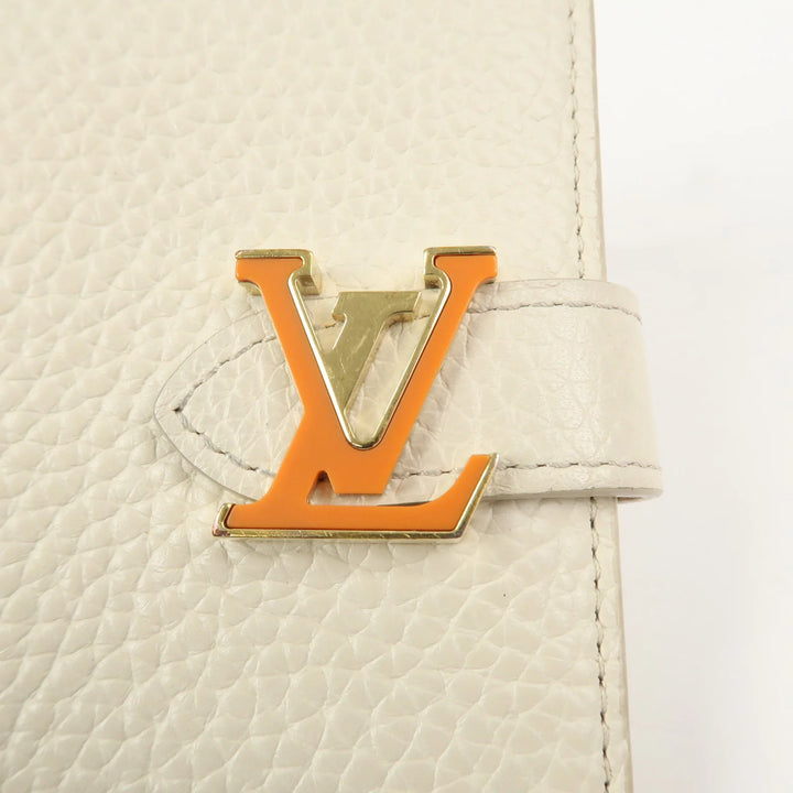 Louis Vuitton Capcines Taurillon Leather Vertical Wallet M11169