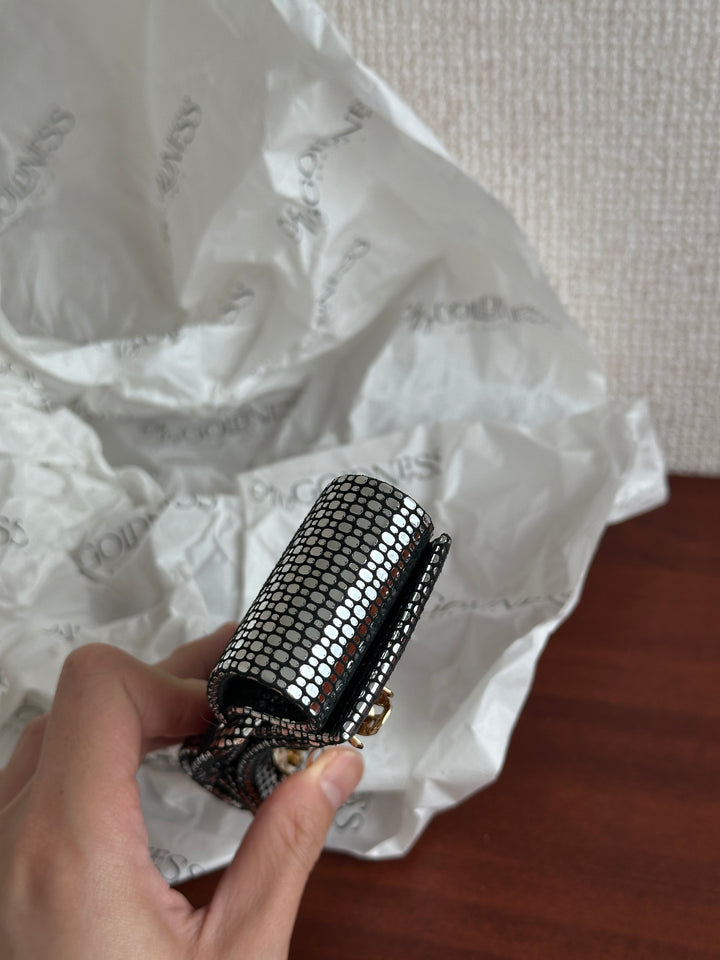 FERRAGAMO Leather Bow Hair Clip – Shimmer Finish & Timeless Elegance