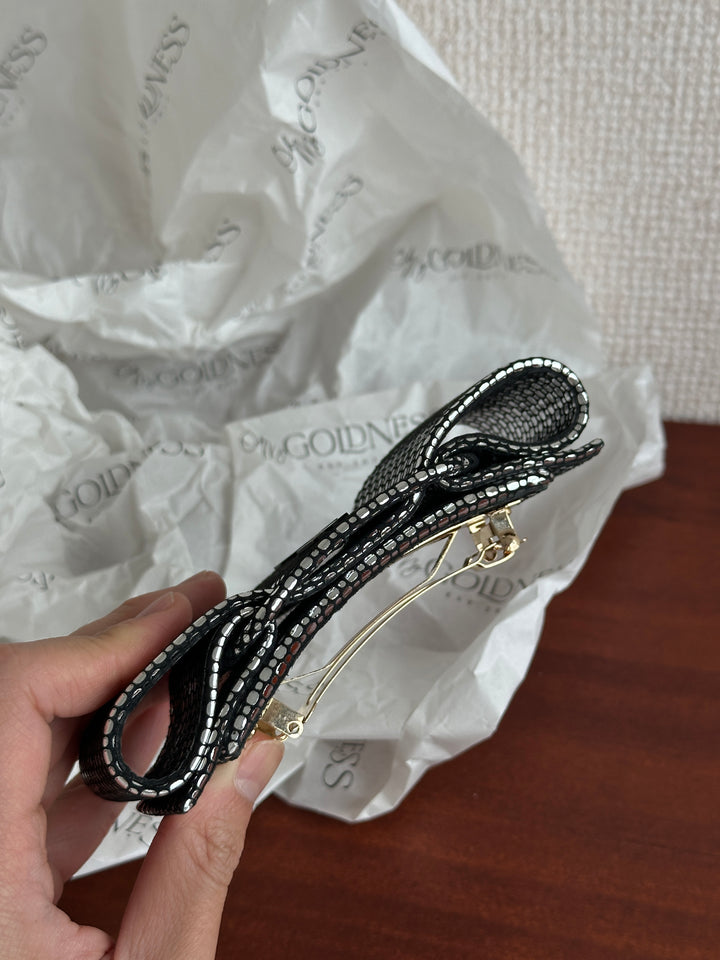 FERRAGAMO Leather Bow Hair Clip – Shimmer Finish & Timeless Elegance