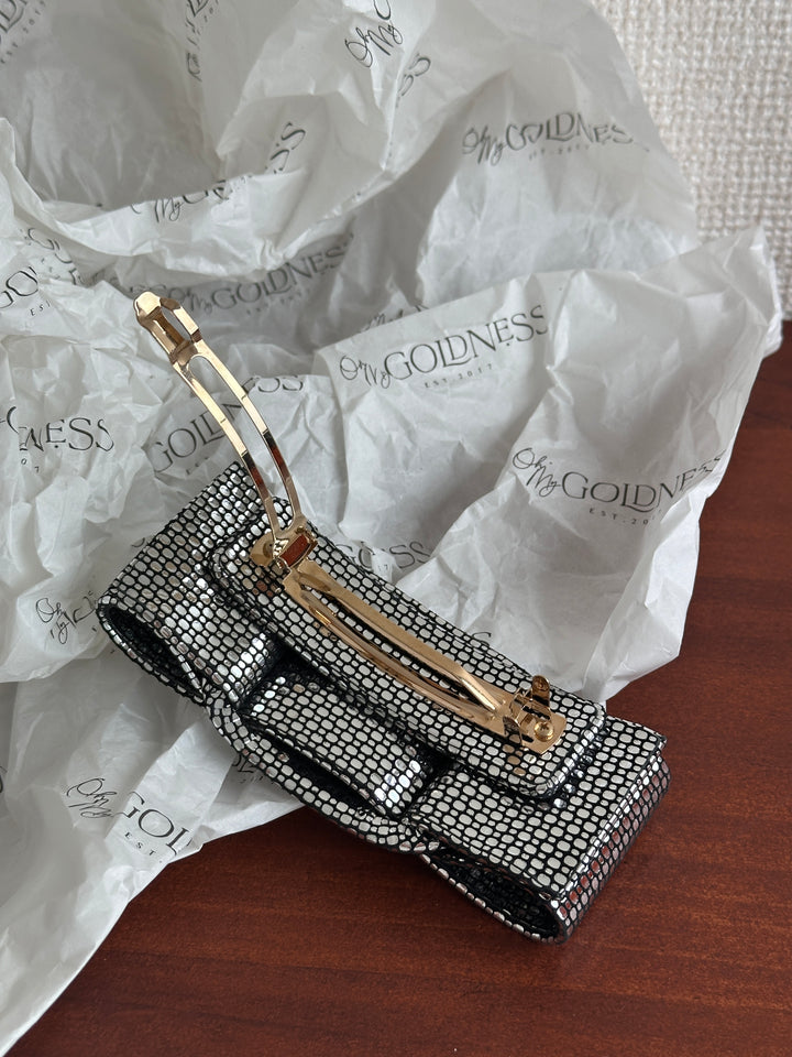FERRAGAMO Leather Bow Hair Clip – Shimmer Finish & Timeless Elegance