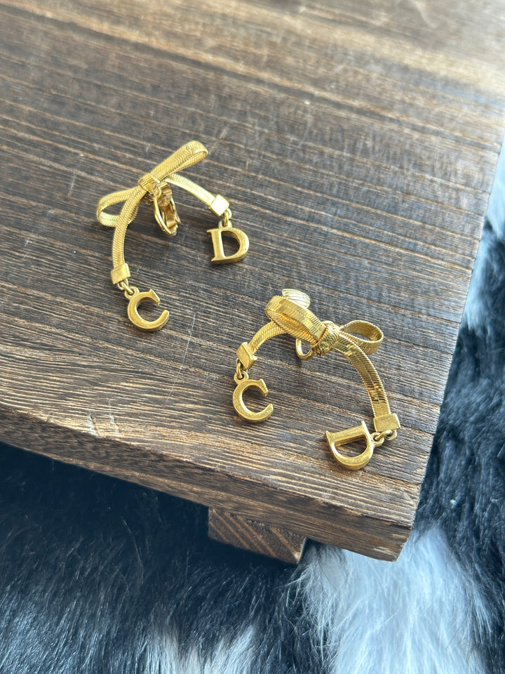 Dior CD Bow Drop Earrings ✨｜Sculptural Ribbon Bow × Swinging CD Charms × Vintage Gold-Tone Finish