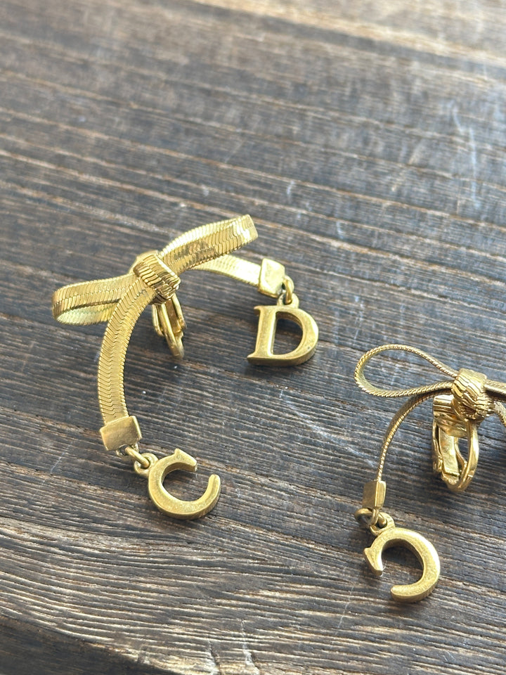 Dior CD Bow Drop Earrings ✨｜Sculptural Ribbon Bow × Swinging CD Charms × Vintage Gold-Tone Finish