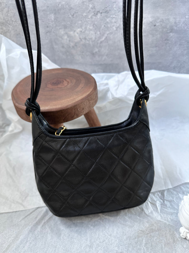 CHANEL Mini Hobo Crossbody – Black Quilted with Gold Ball Tassel 🖤✨