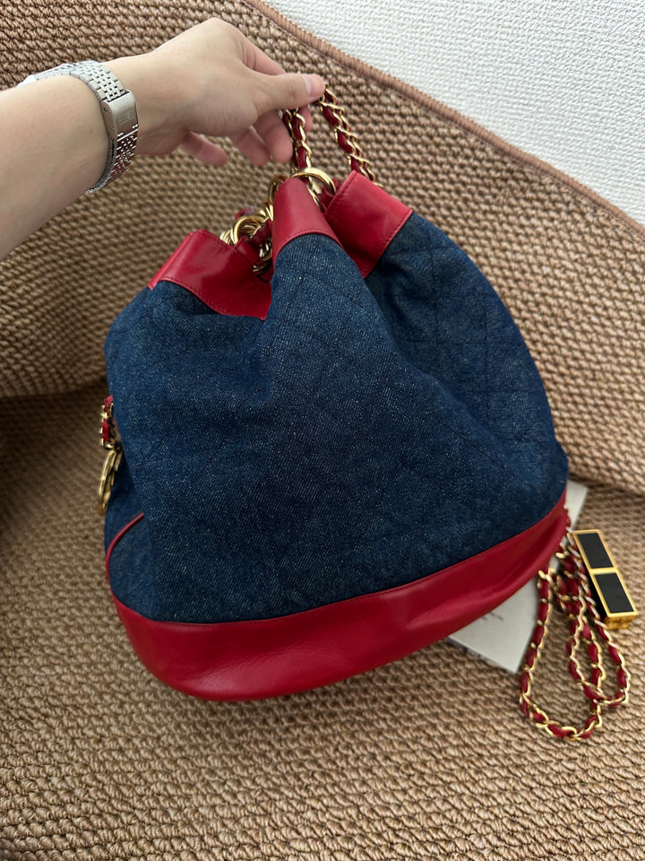 CHANEL Vintage Denim Bucket Backpack — Oversized CC Ring Logo with Red Leather Trim 🔥🖤 Casual Luxe Statement