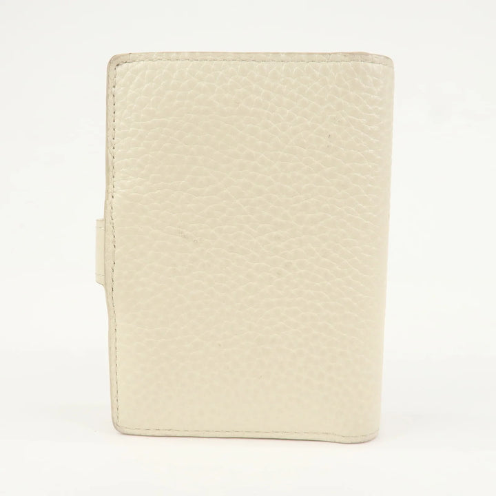 Louis Vuitton Capcines Taurillon Leather Vertical Wallet M11169