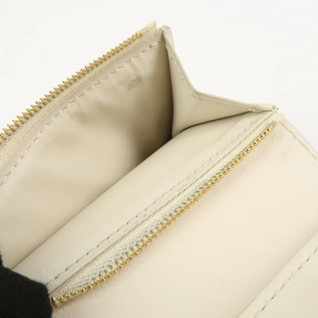 Louis Vuitton Capcines Taurillon Leather Vertical Wallet M11169
