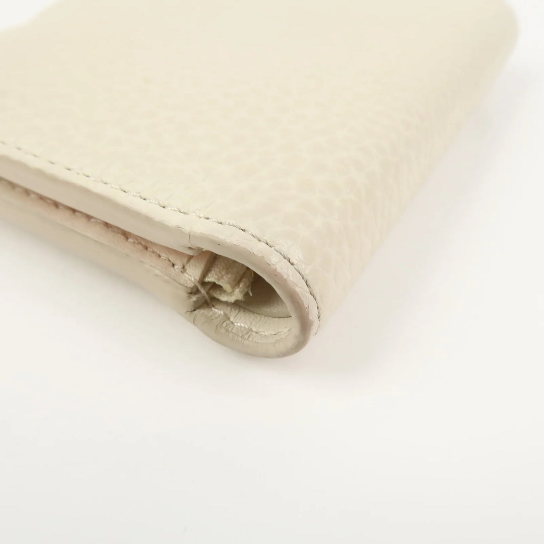 Louis Vuitton Capcines Taurillon Leather Vertical Wallet M11169
