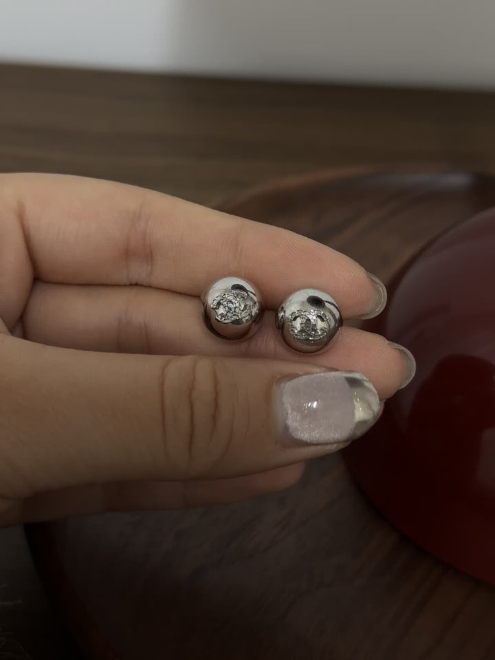 CHANEL Silver Sphere Logo Earrings – Minimal Chic × Timeless Metallic Glow ✨